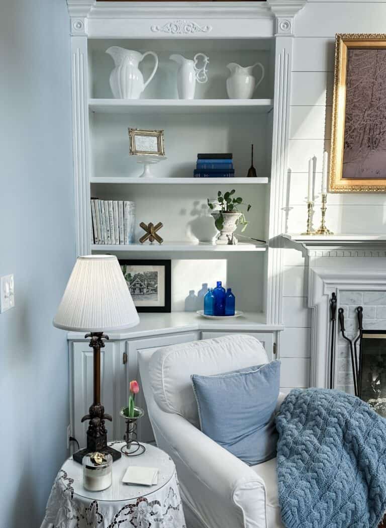 corner of our living space that has floor to ceiling built-in bookshelves for storage and organization