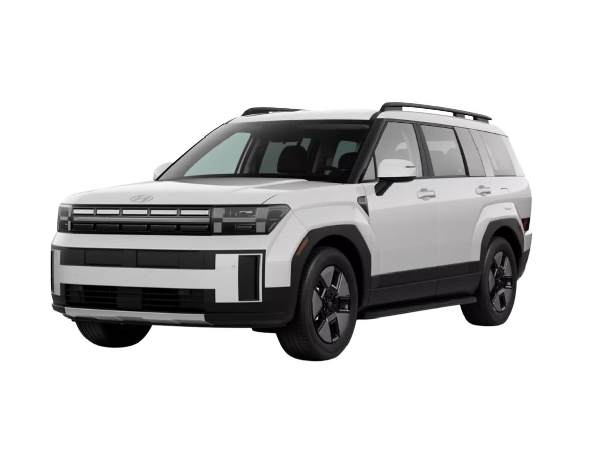 The latest white SUV with black trim and roof rails, featuring a boxy design and modern front grille, is parked on a plain white background.