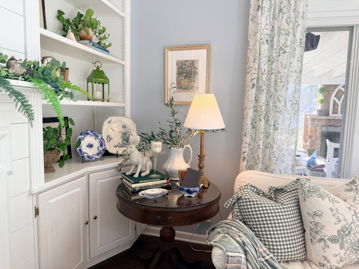 Living room with Sherwin Williams Upward blue walls and cottage style decor