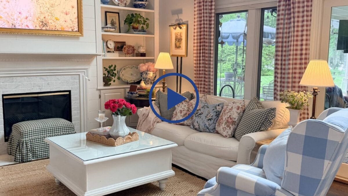 Cozy living room with floral cushions and plaid curtains—perfect inspiration on how to refresh your home for summer.