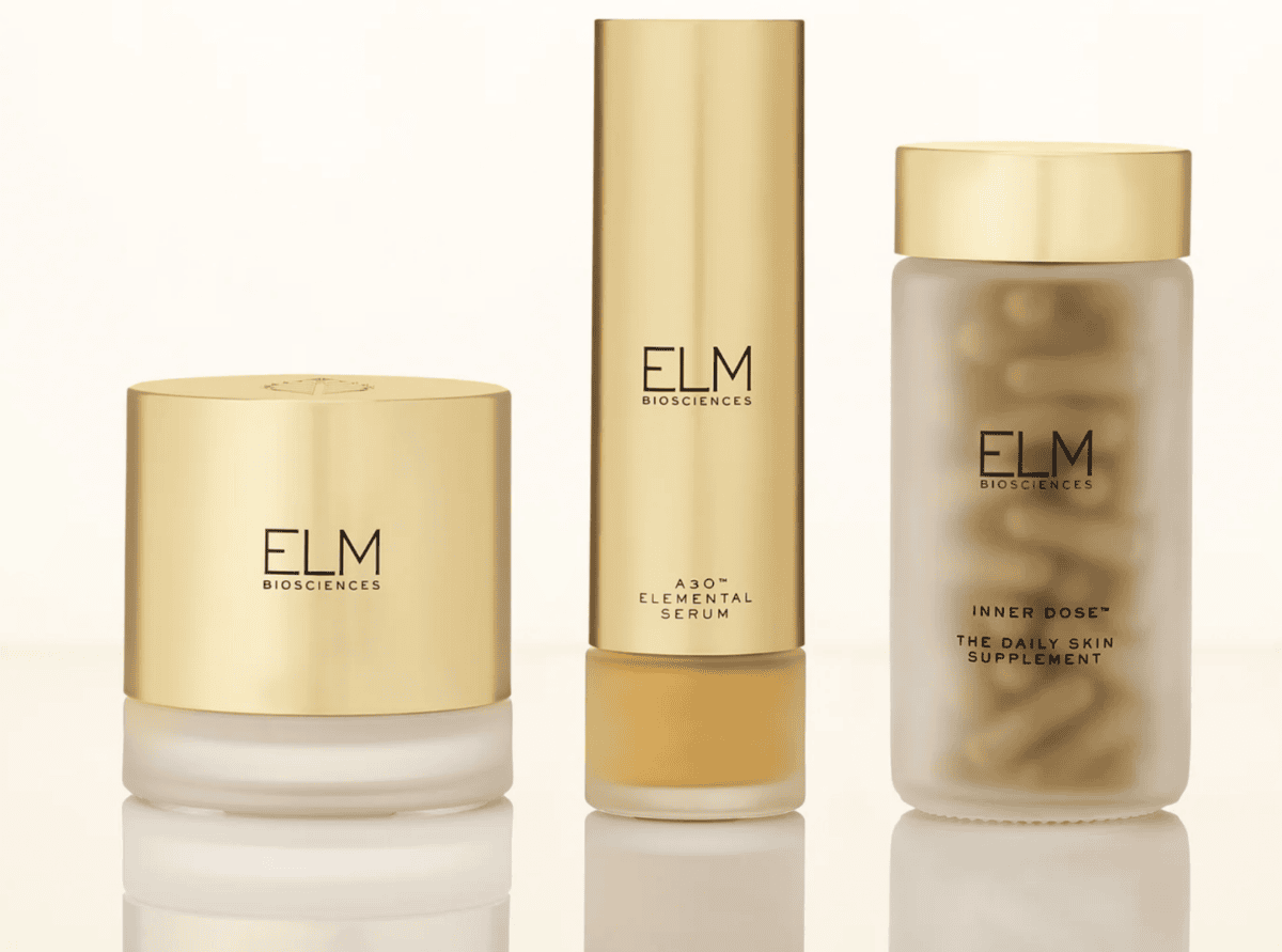 Three gold-capped ELM Biosciences skincare products, perfect for your next shopping haul: cream, serum, and supplements.