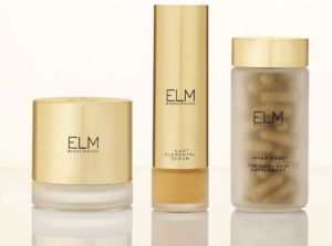 Three gold-capped ELM Biosciences skincare products, perfect for your next shopping haul: cream, serum, and supplements.