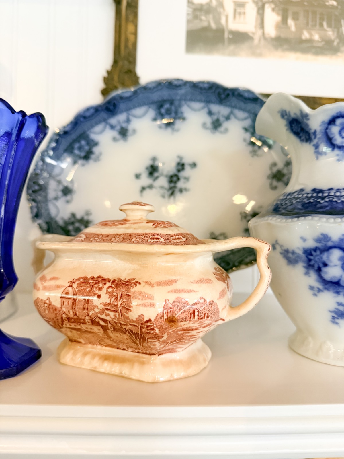 A small, vintage ceramic sugar bowl adds charm—perfect inspiration for how to refresh your home for summer shelves.