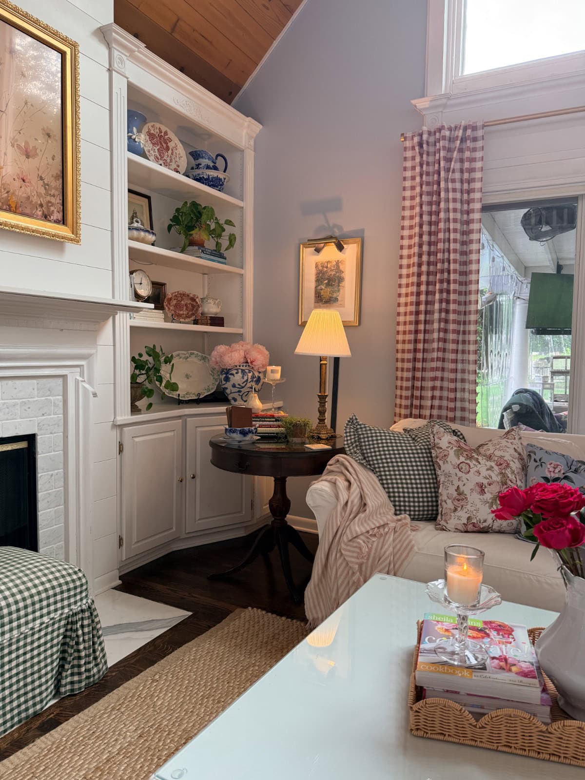 Cozy living room with floral and gingham patterns—perfect inspiration for how to refresh your home for summer.