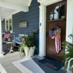 Exterior of a small river home with a white front porch in the Chicago suburbs