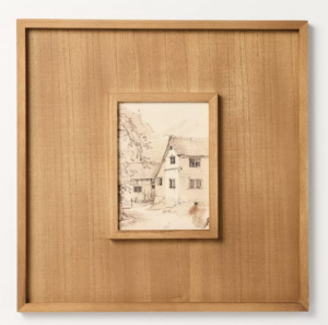 Framed sketch of a house with trees, ideal for shopping enthusiasts seeking unique decor in a wide wooden frame.
