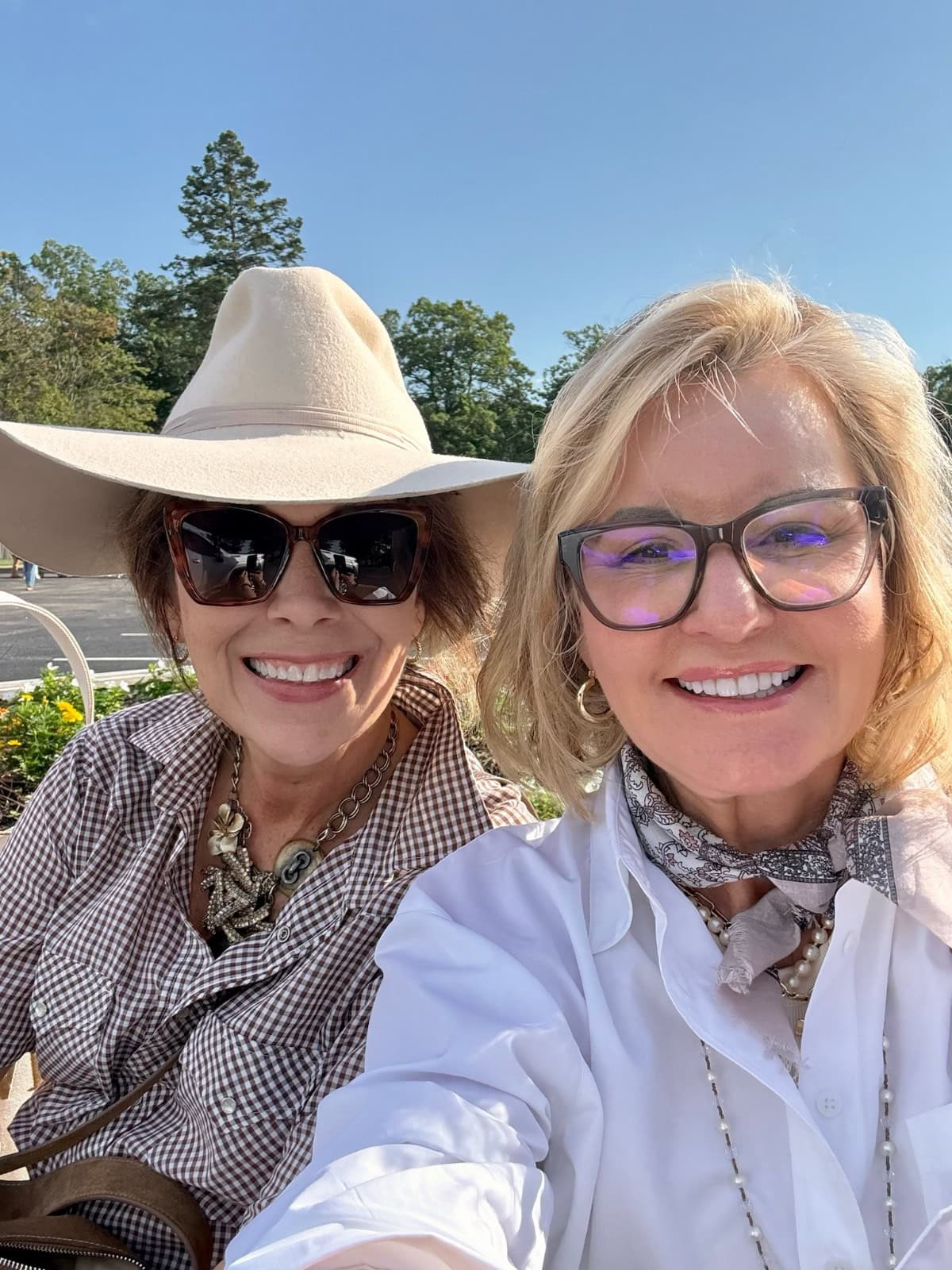 Two women enjoy the Found Cottage Mercantile Market—what to expect: friendly smiles and unique finds as you shop.