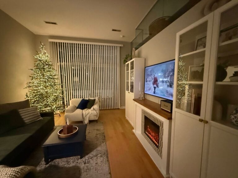9 ft unlit King Noble Fir wrapped in firecracker lights in a Chicago loft.